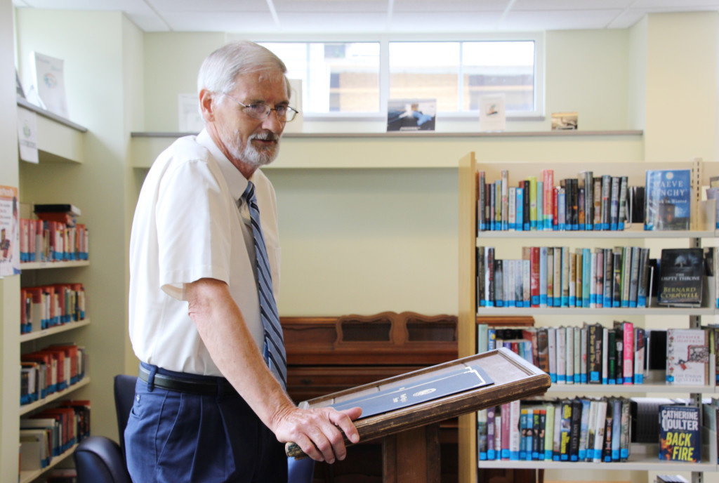 Roger Engle, award-winning author of "Stories from a Small Town: Remembering My Childhood in Hedgesville, West Virginia," speaks after being recognized by both the Senate of West Virginia and House of Delegates of the West Virginia Legislature at a ceremony held at Hedgesville Public Library on June 20, 2015. | Photo by Stephanie Engle
