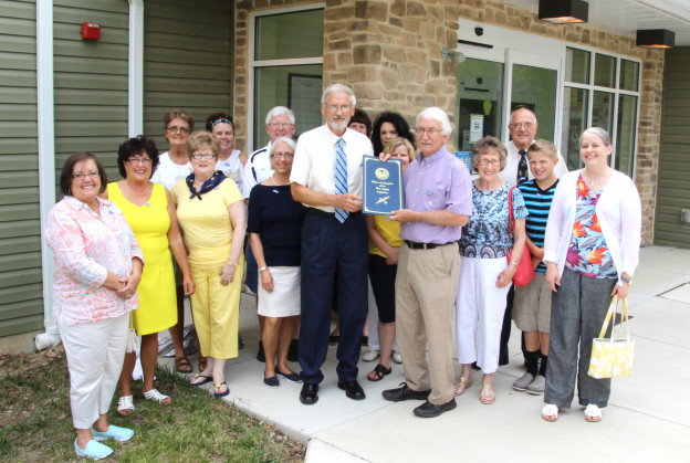 Roger Engle, with West Virginia State Delegate Walter Duke (R-Berkeley, 61) and guests at a ceremony held at Hedgesville Public Library on June 20, 2015 to honor the award-winning, West Virginia author. | Photo by Stephanie Engle